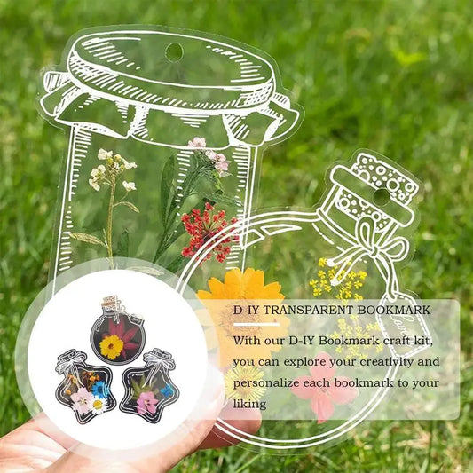 Transparent bookmark craft kit with decorative elements on a grass background