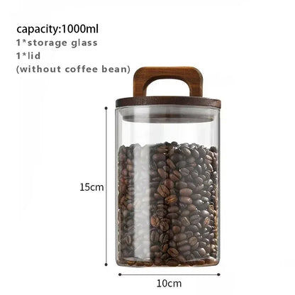 Glass coffee bean storage jar with wooden lid and measurements on a white background