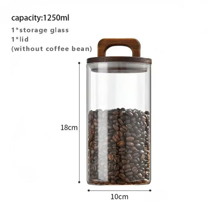 Glass storage jar with wooden lid containing coffee beans, dimensions displayed.