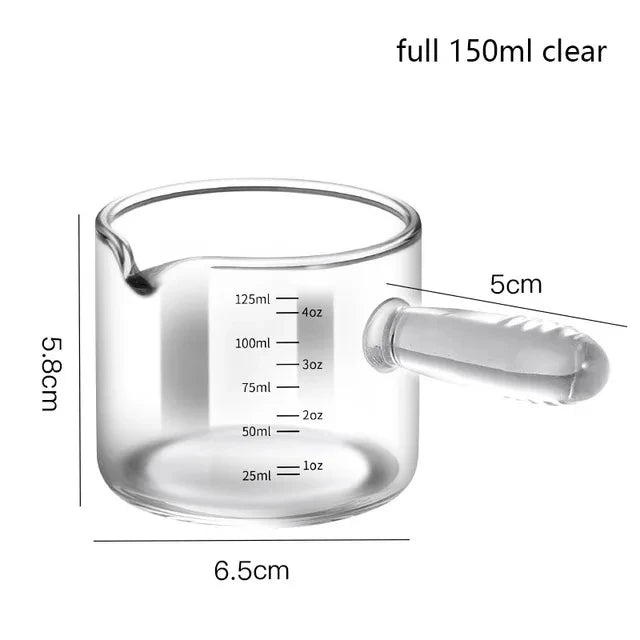 Clear glass measuring cup with handle and measurement markings, shown with dimensions on a white background.
