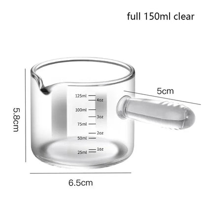Clear glass measuring cup with handle and measurement markings, shown with dimensions on a white background.