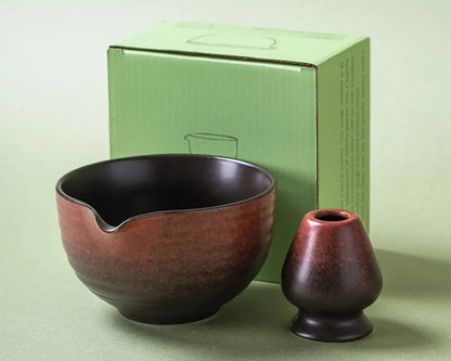 Two ceramic bowls on a light green background with a matching box.