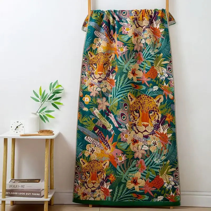 Colorful curtain with tiger and floral pattern hanging on a wooden rod against a white wall.
