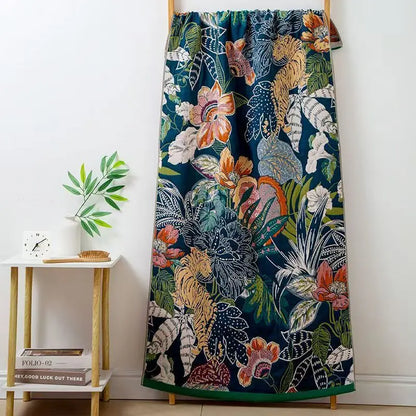 Floral and animal patterned curtain on a wooden rod against a white wall.
