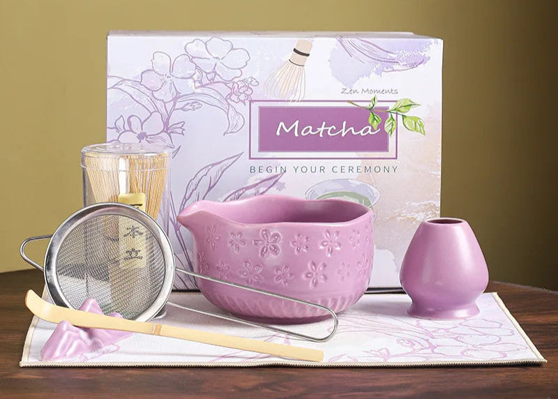 Matcha tea set with a book titled 'Matcha' on a wooden surface.