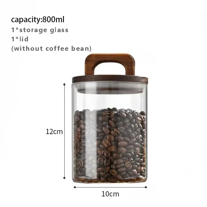 Glass storage jar with wooden lid containing coffee beans, dimensions shown.