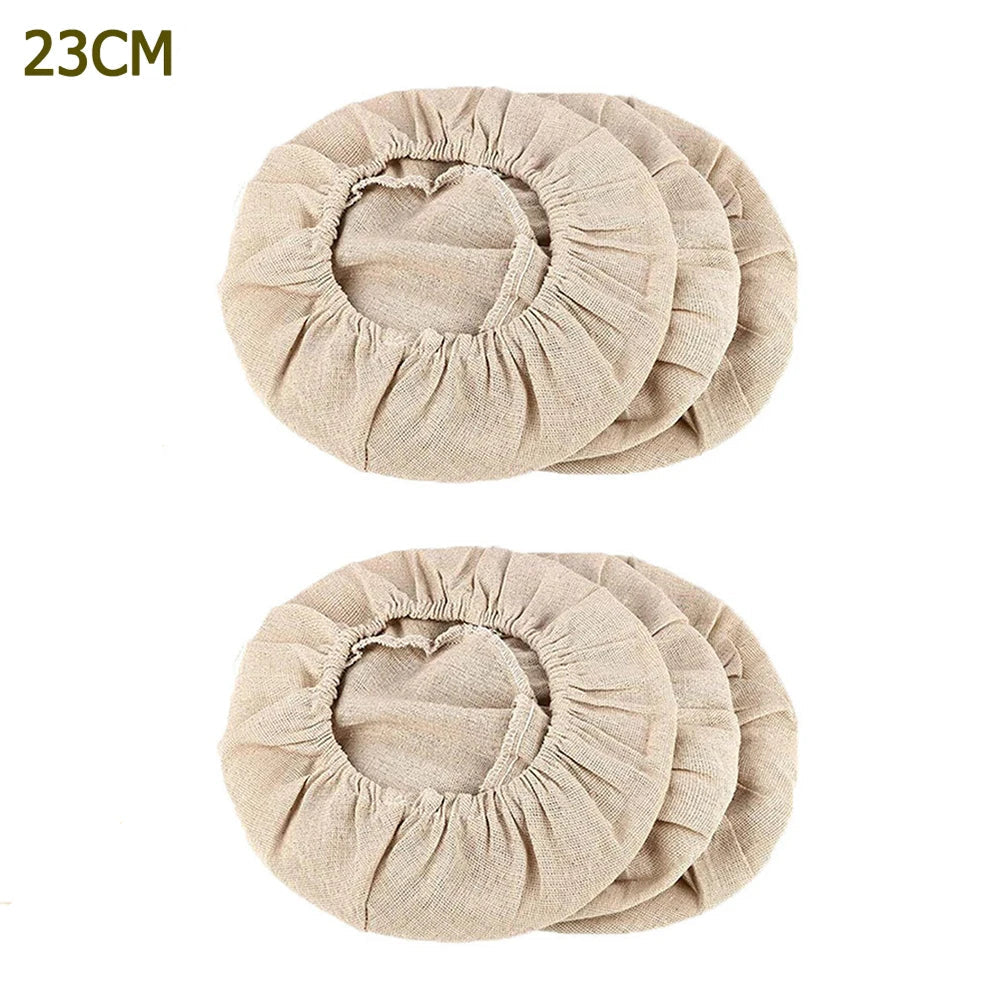 Two beige circular fabric covers with '23CM/9INCH' text above them on a white background.