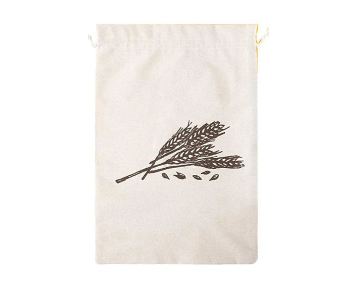 Beige drawstring bag with a black leaf design on a white background