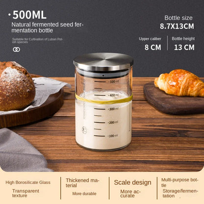 500ml fermentation seed bottle with bread and croissant on a wooden surface