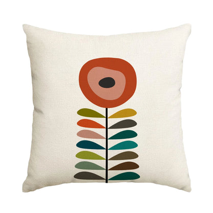 Decorative pillow with a colorful flower design on a white background