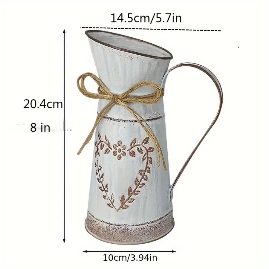 White pitcher with decorative heart design and jute bow, shown with measurements on a white background.