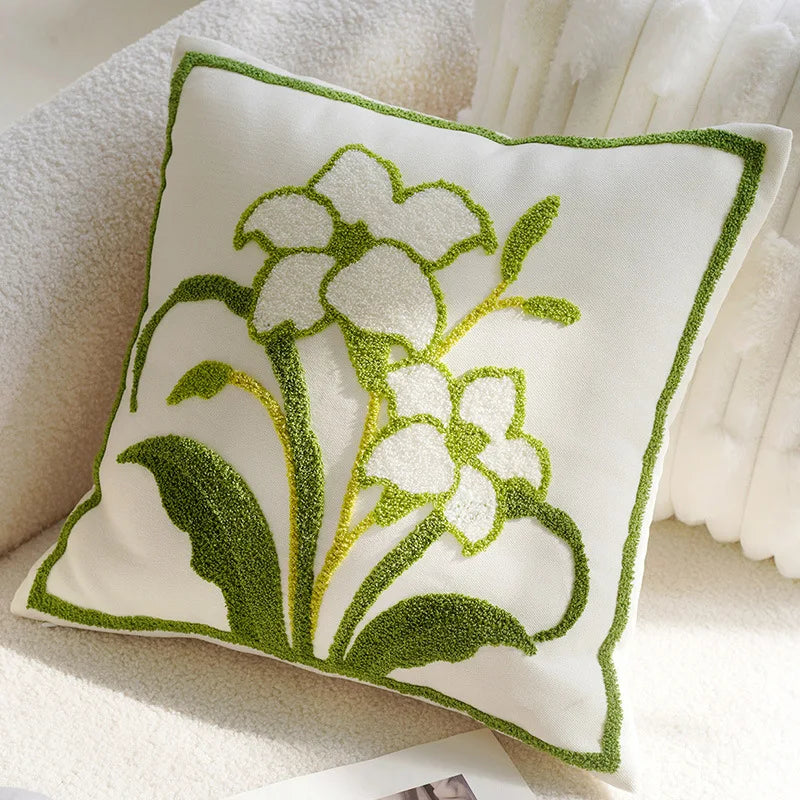 Decorative pillow with floral design on a soft surface