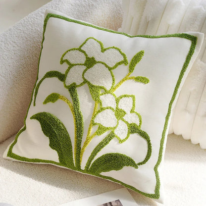 Decorative pillow with floral design on a soft surface