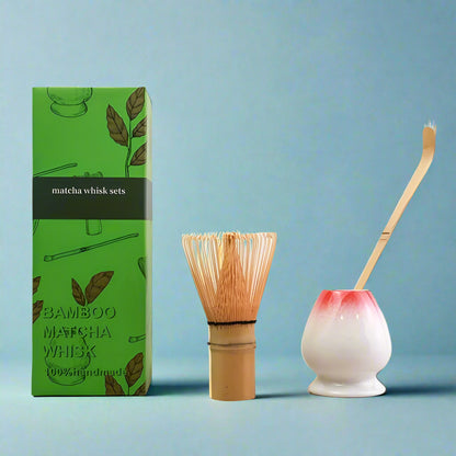 Bamboo matcha whisk and ceramic whisk holder with green packaging on a white background