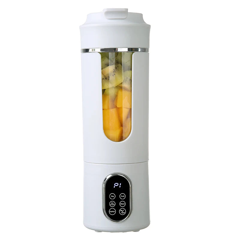 White portable blender with fruits inside on a white background
