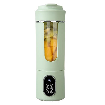 Mint green portable blender with a clear lid showing ingredients on a white background