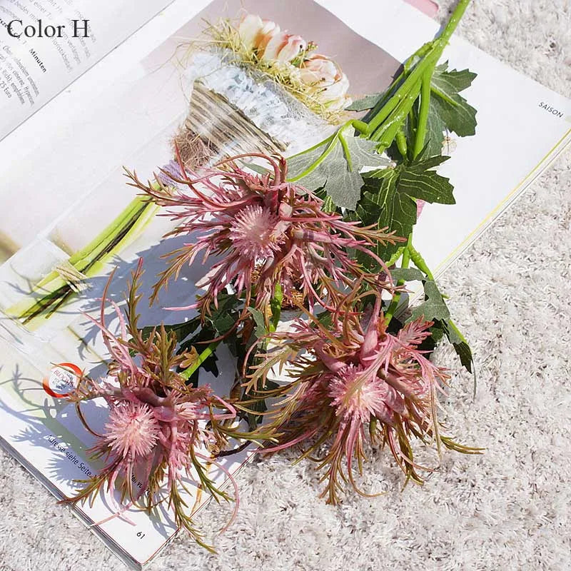 Pink and green decorative flowers on a magazine