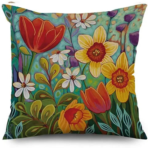 Colorful floral pillow with vibrant flowers on a white background