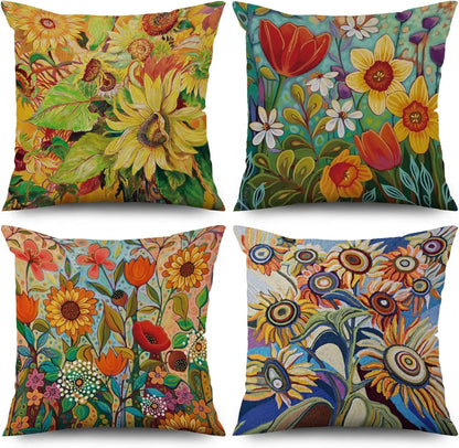 Four colorful floral-patterned pillows on a white background