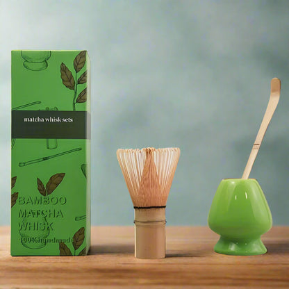 Bamboo matcha whisk set with green container and packaging on a white background