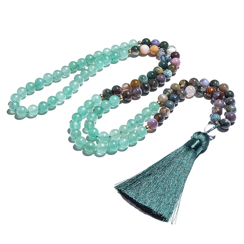 Multicolored beaded necklace with a green tassel on a white background