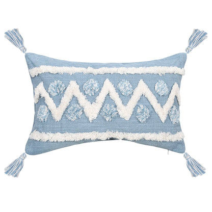 Decorative blue pillow with white zigzag pattern and tassels on a white background