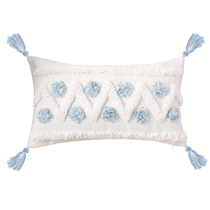 Decorative pillow with blue floral patterns and tassels on a white background