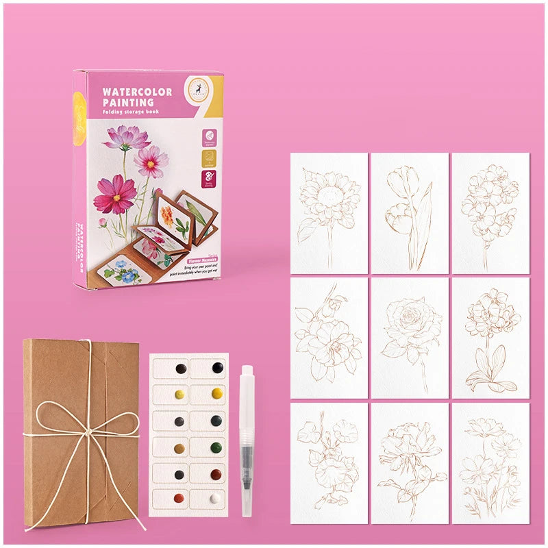 Artistic set with watercolor painting book, cards, and watercolors on a pink background