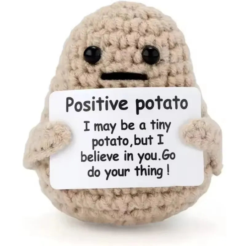 Plush toy resembling a potato with a message card on a white background