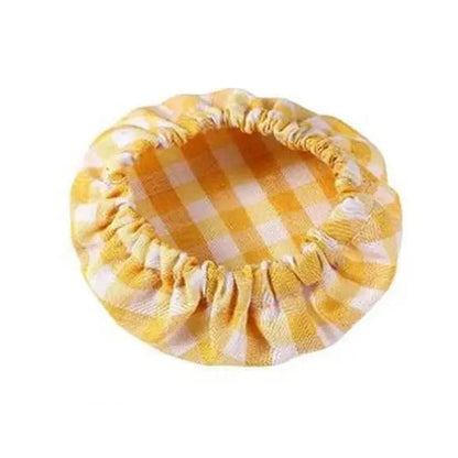 Yellow checkered pet bed on a white background