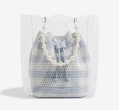 Crocheted bag with pearl details on a white background