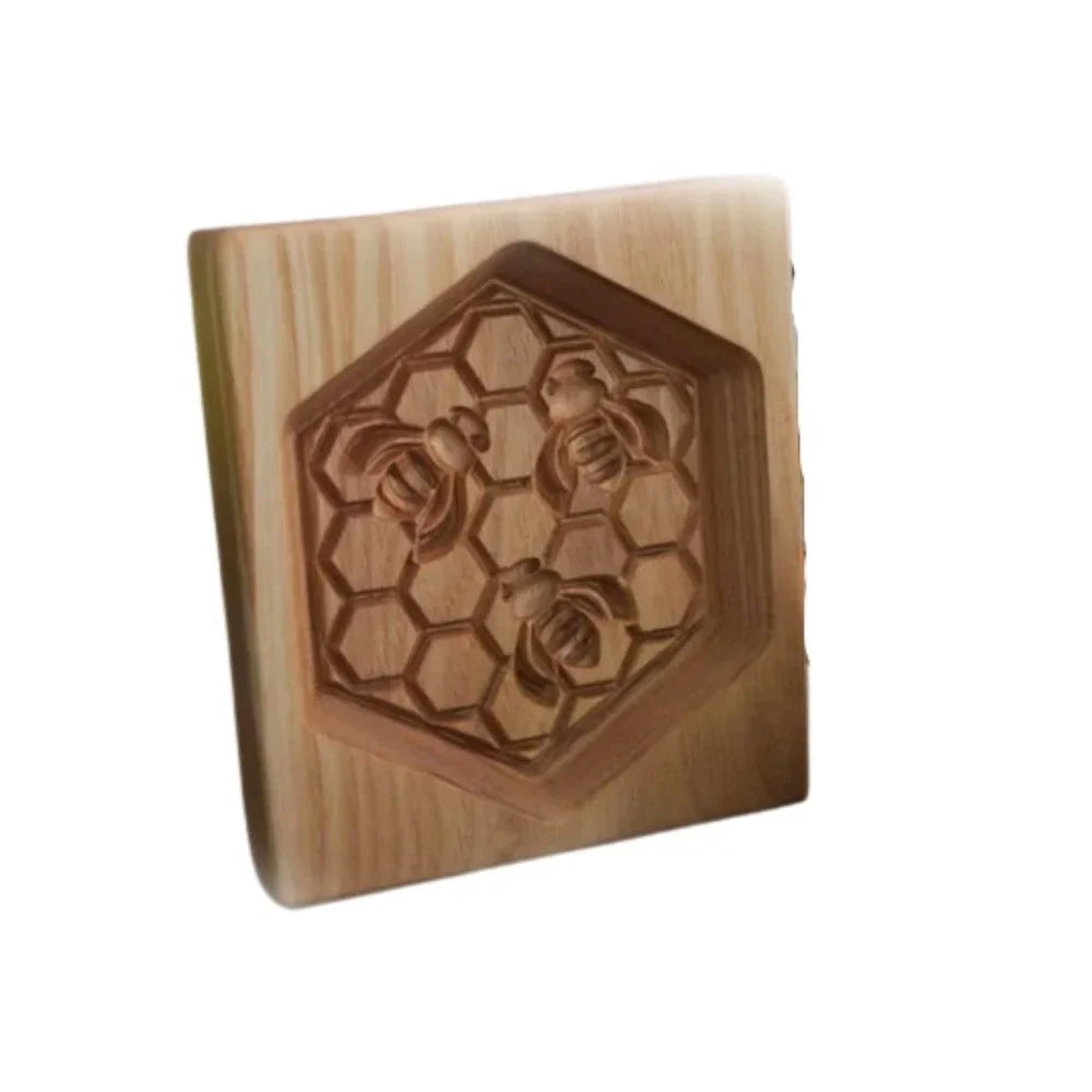 Wooden block with bee and honeycomb design on a white background