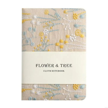 Floral patterned cloth notebook with 'Flower & Tree' text on a white background