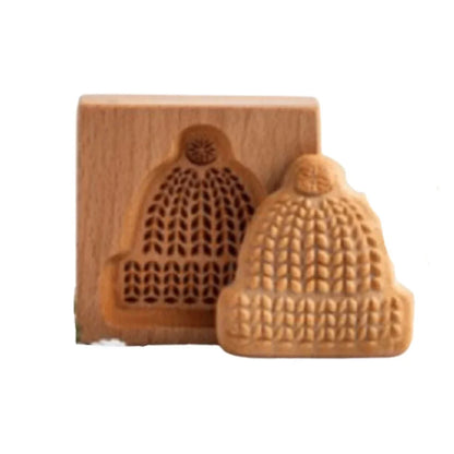 Wooden mold shaped like a knitted hat on a white background