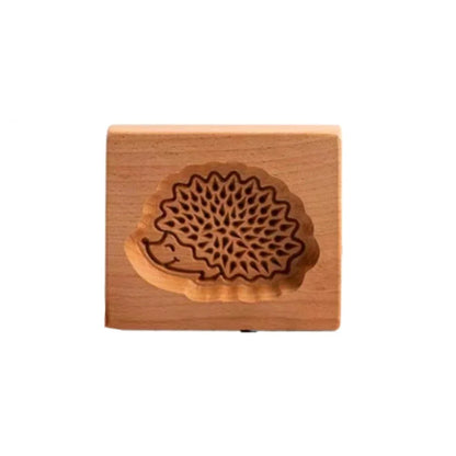 Wooden stamp with a floral design on a white background