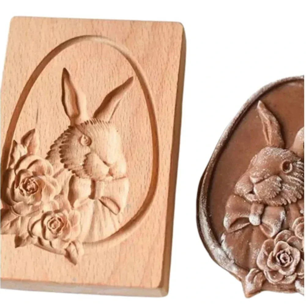 Wooden mold with a rabbit and flower design, showing a silicone mold impression.