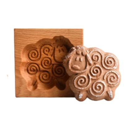 Wooden sheep mold with a shaped sheep cookie on a white background