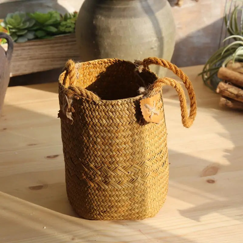 Woven basket with handles on a wooden surface