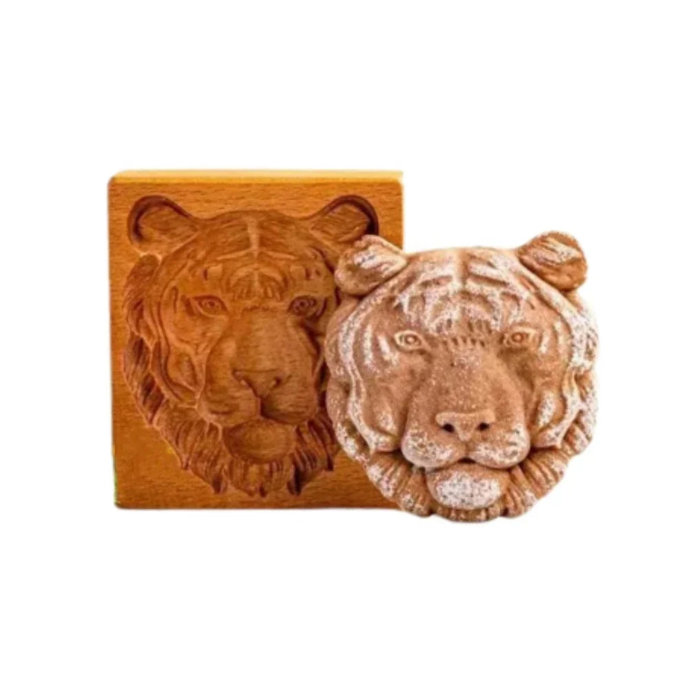 Tiger-shaped soap next to a wooden mold on a white background